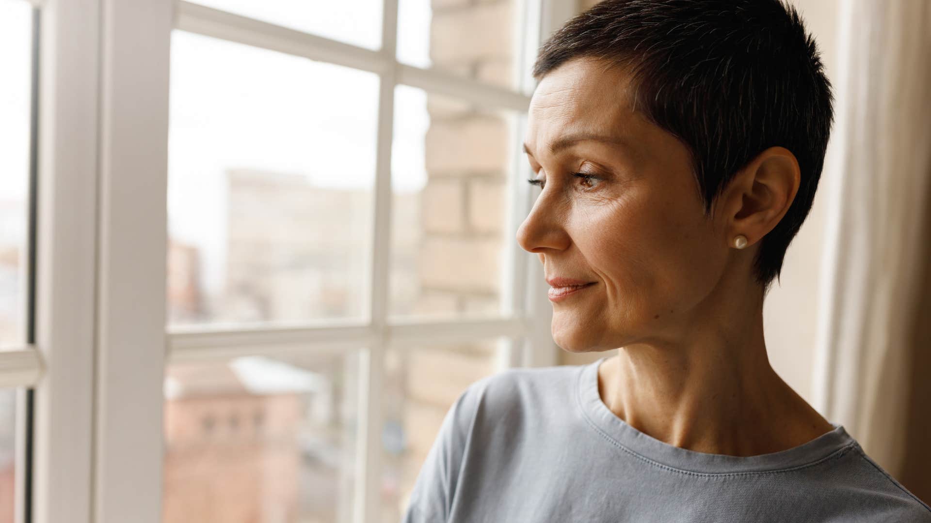 Woman who's acting calmer, but not feeling happier at home.