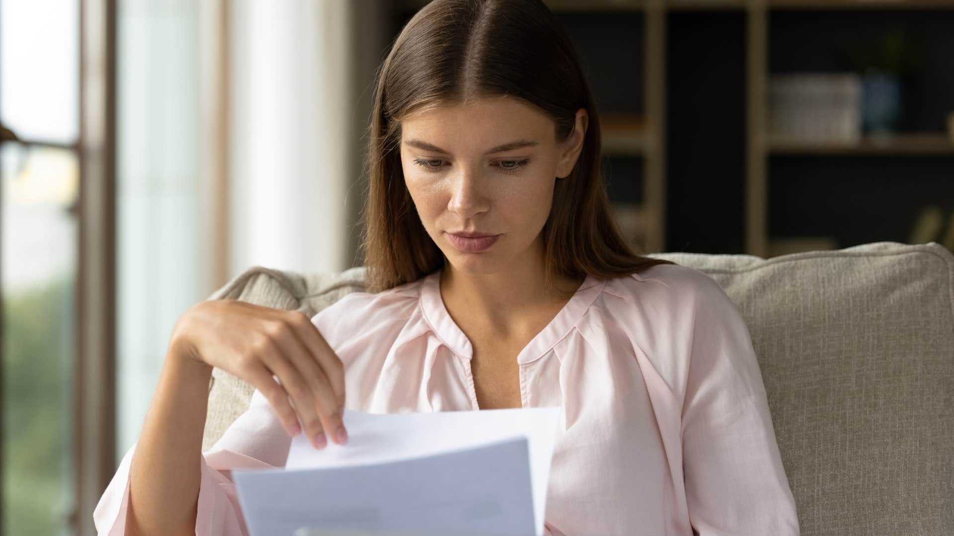 Woman making plans and decisions alone at home.