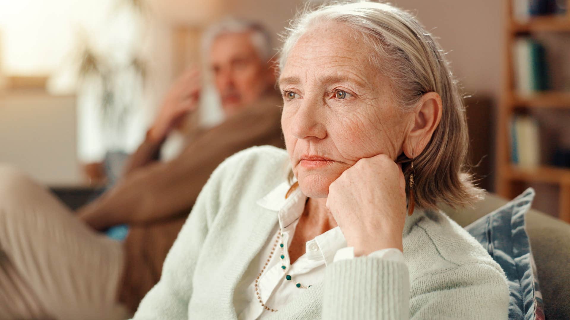 Woman spending more time apart from her husband looking upset.