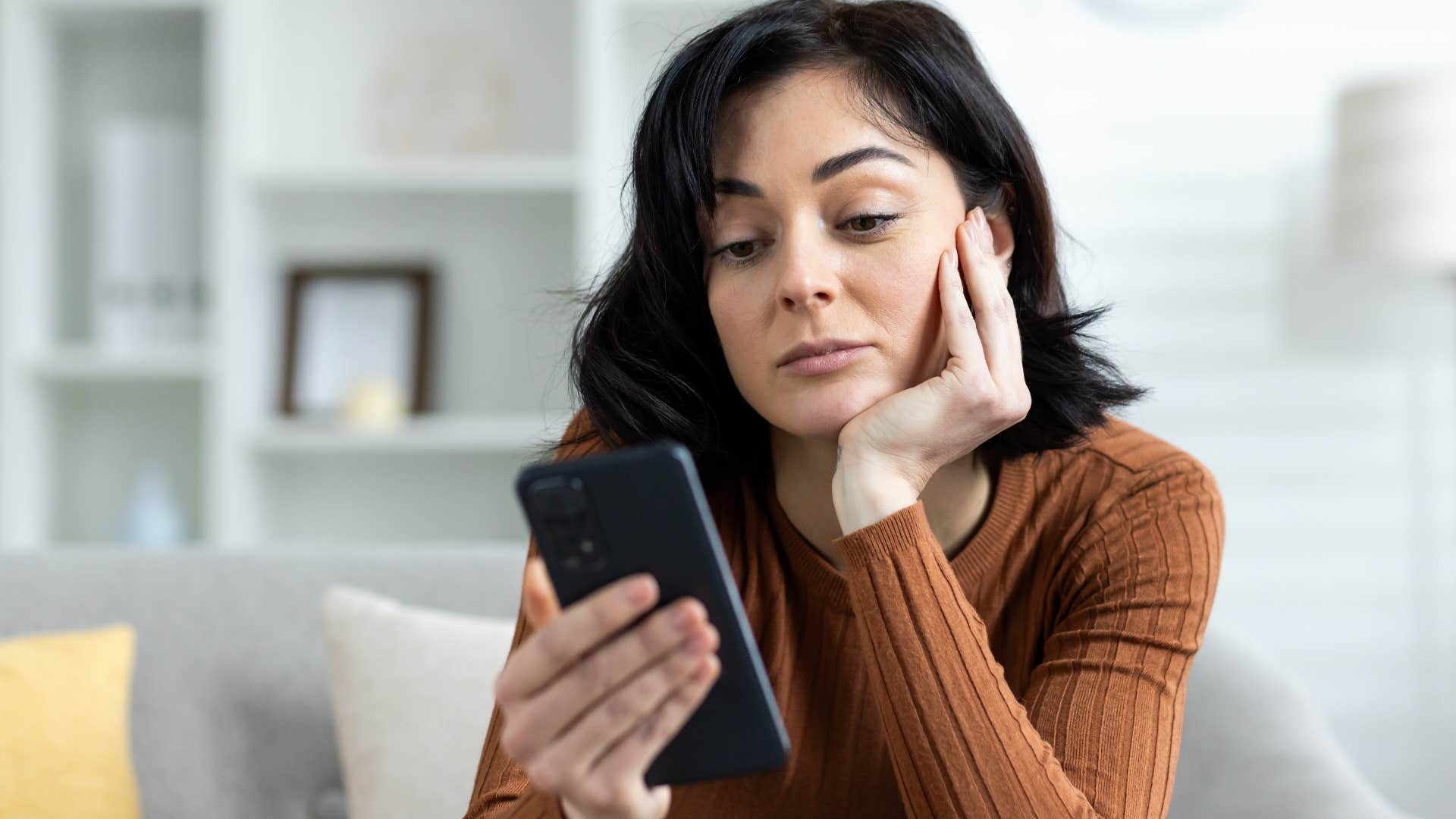 Upset woman who's spending more time on their phones.