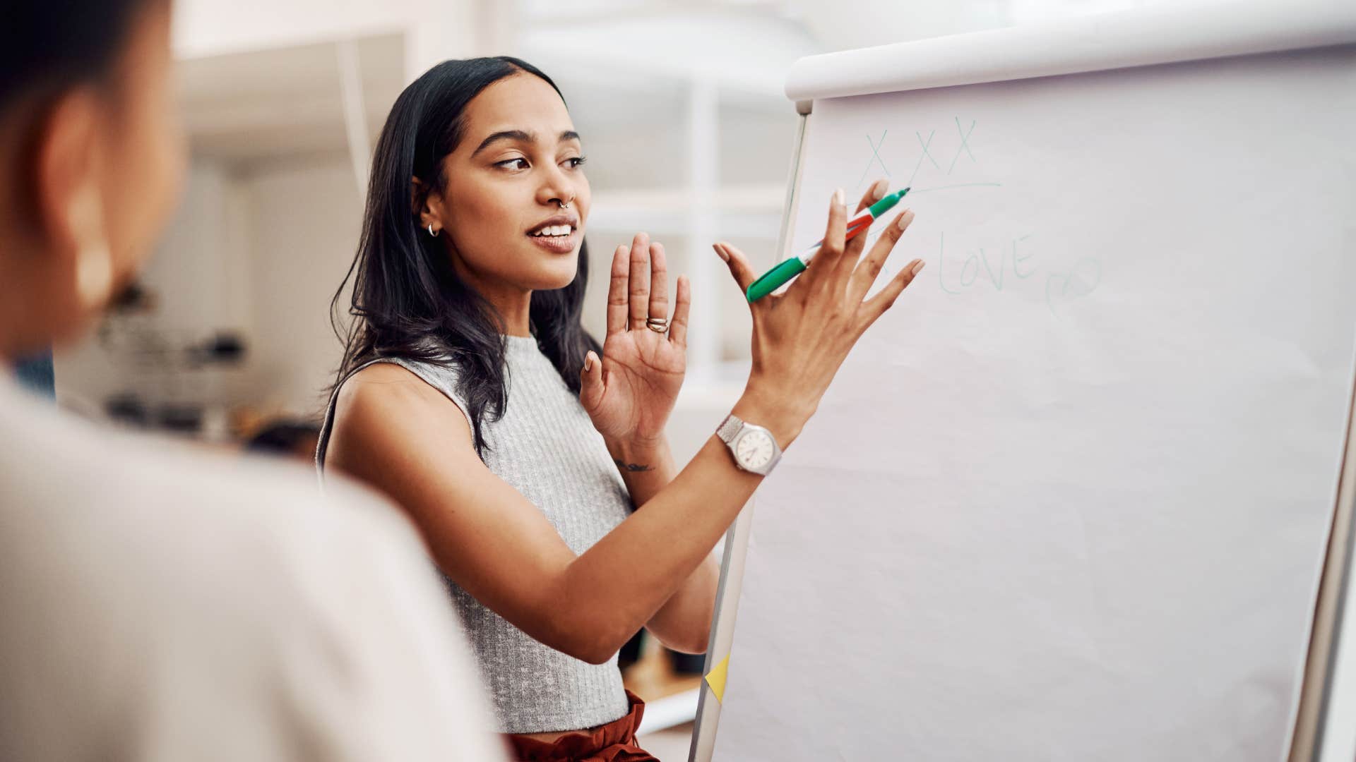 woman being overconfident while presenting at work