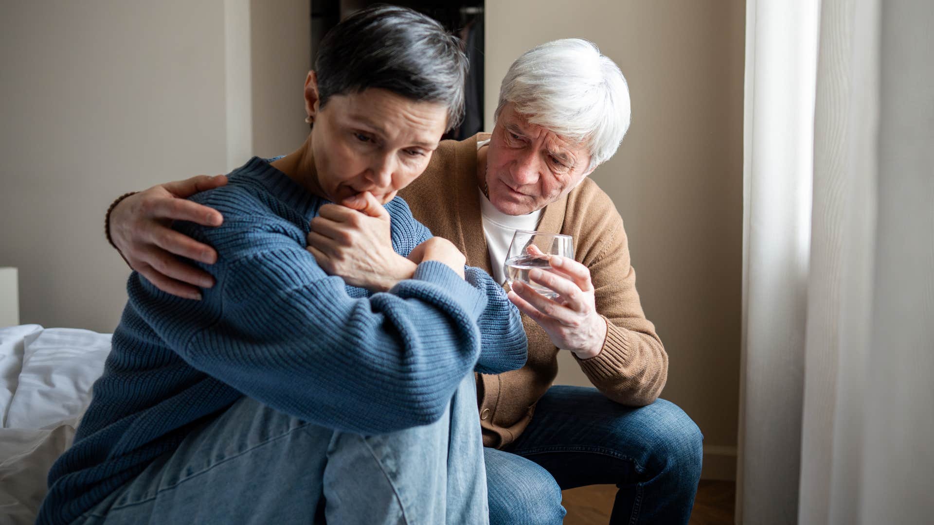 woman over-apologizing next to her upset partner