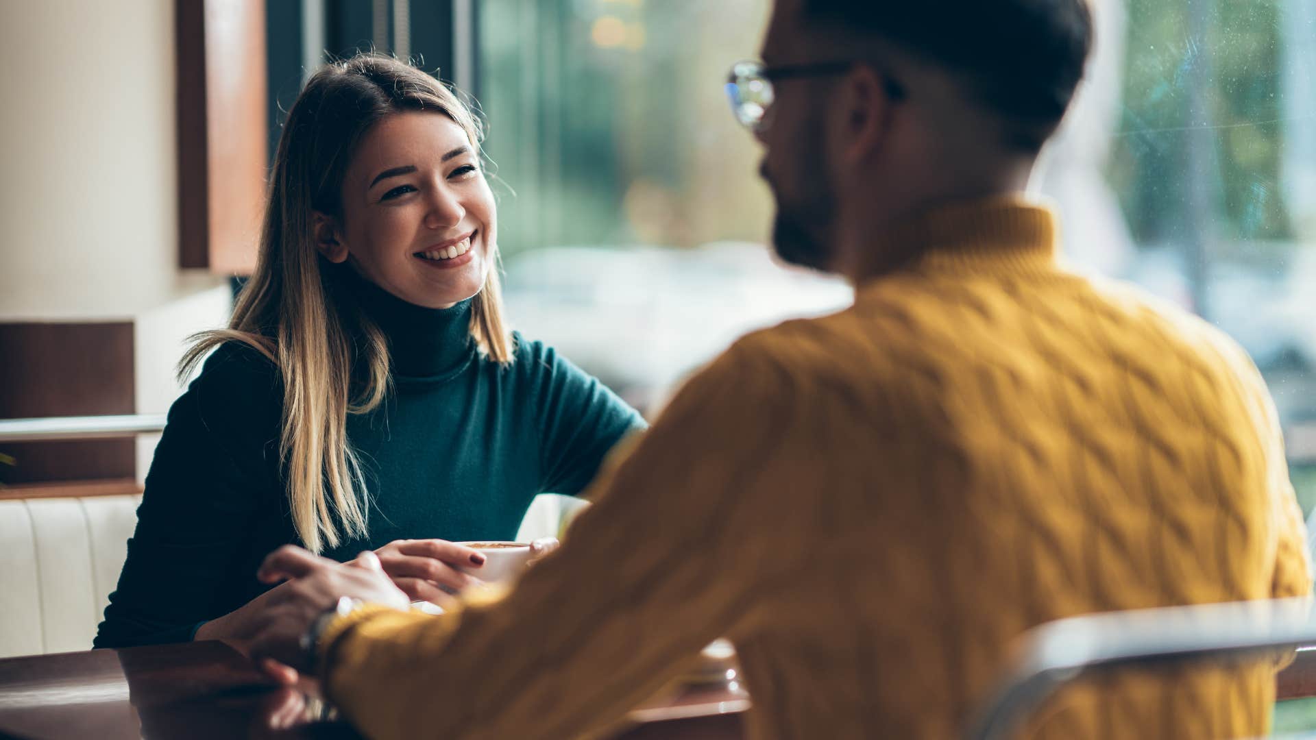 man talking to woman who is being a people pleaser