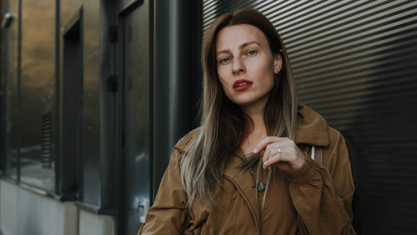 People Who Lack Class Often Think These Things Are Great Ideas classless woman standing on the street looking serious