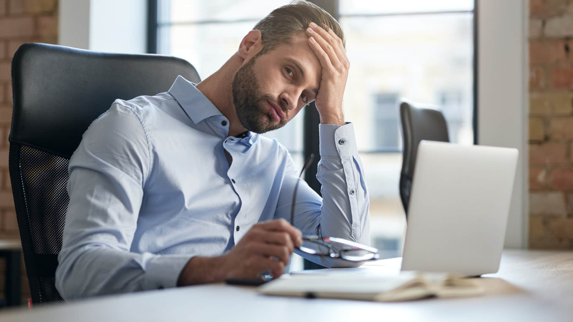 man whose social battery is drained and needs silence at the end of the workday