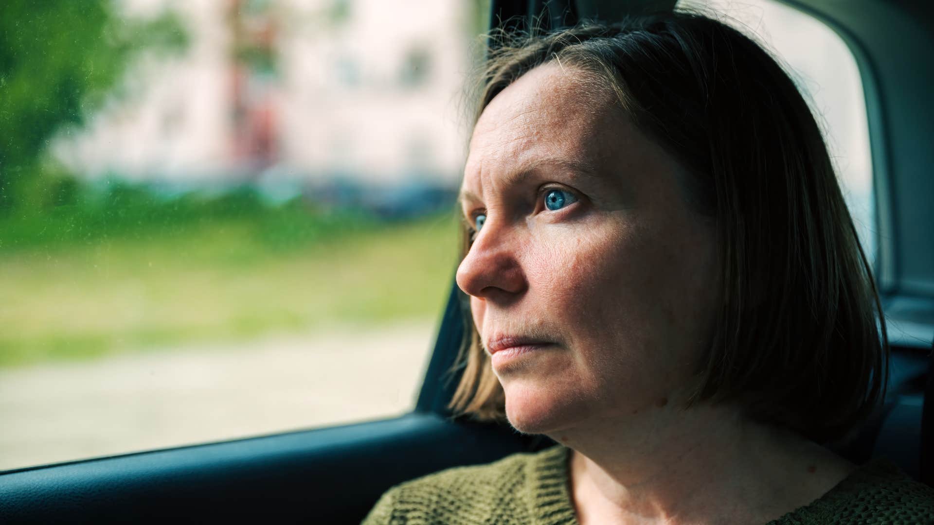woman still processing the day who needs silence at the end of the workday
