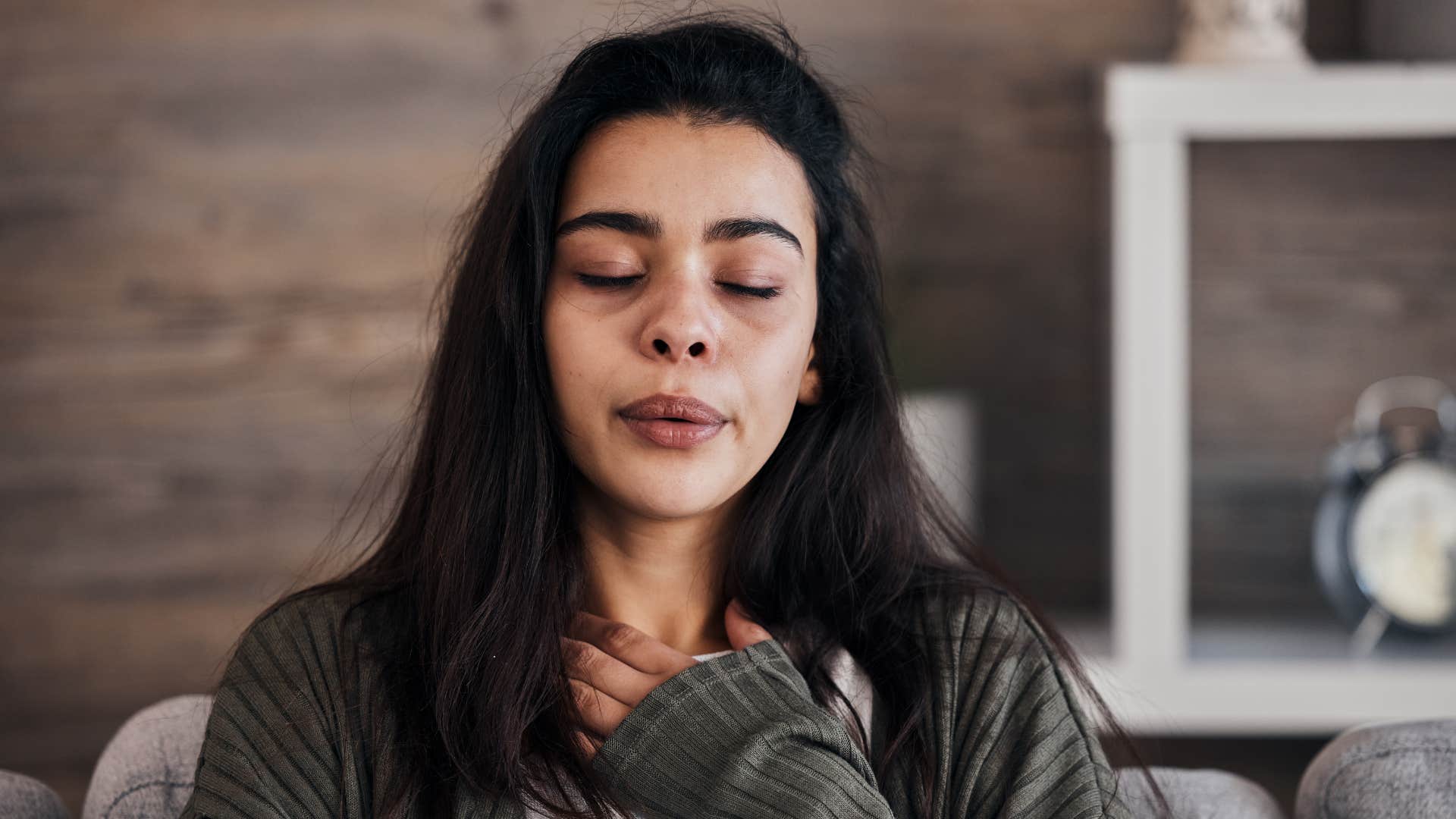 woman trying to calm her anxiety who needs silence at the end of the workday