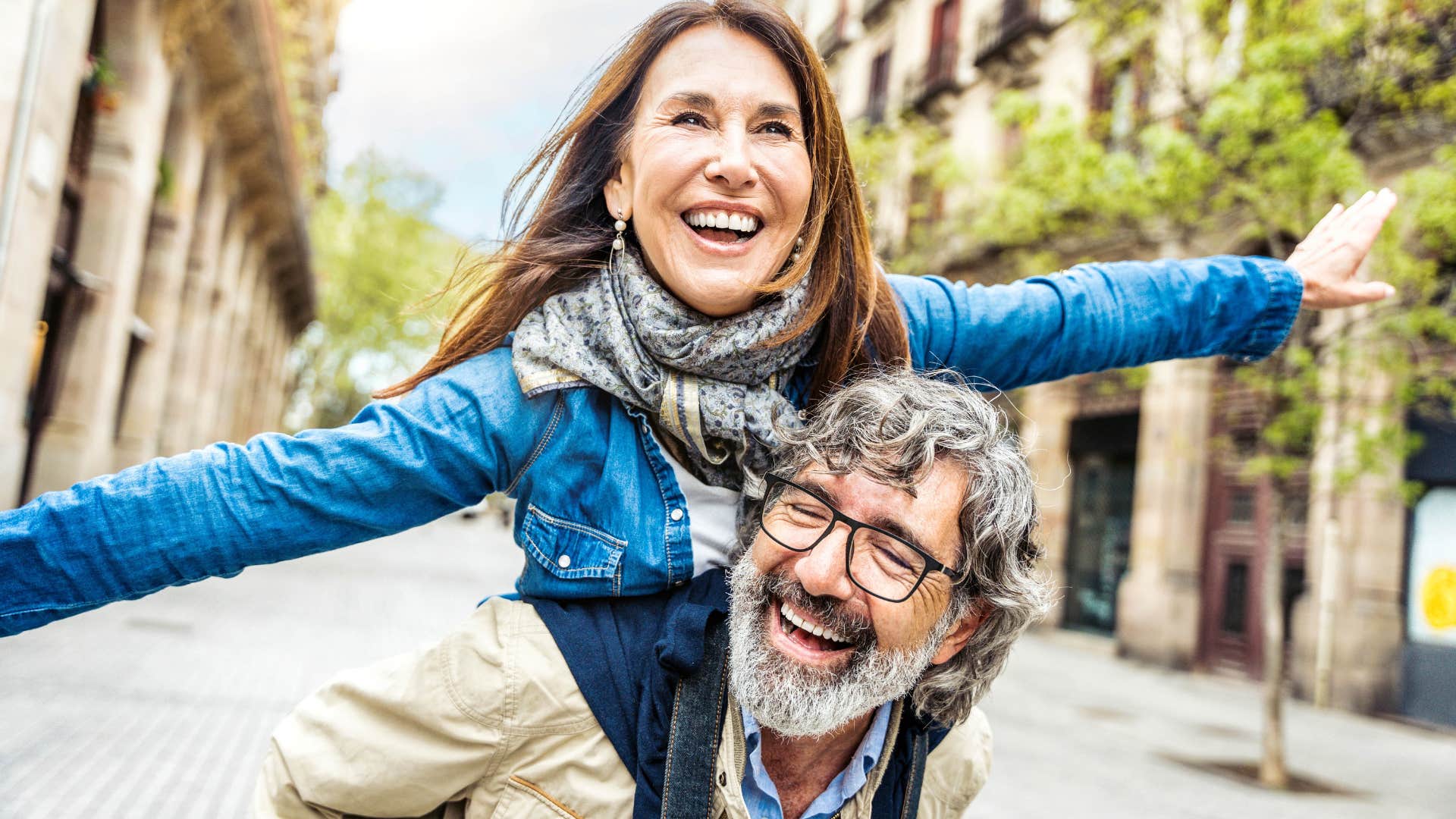 authentic couple smiling and walking around outside