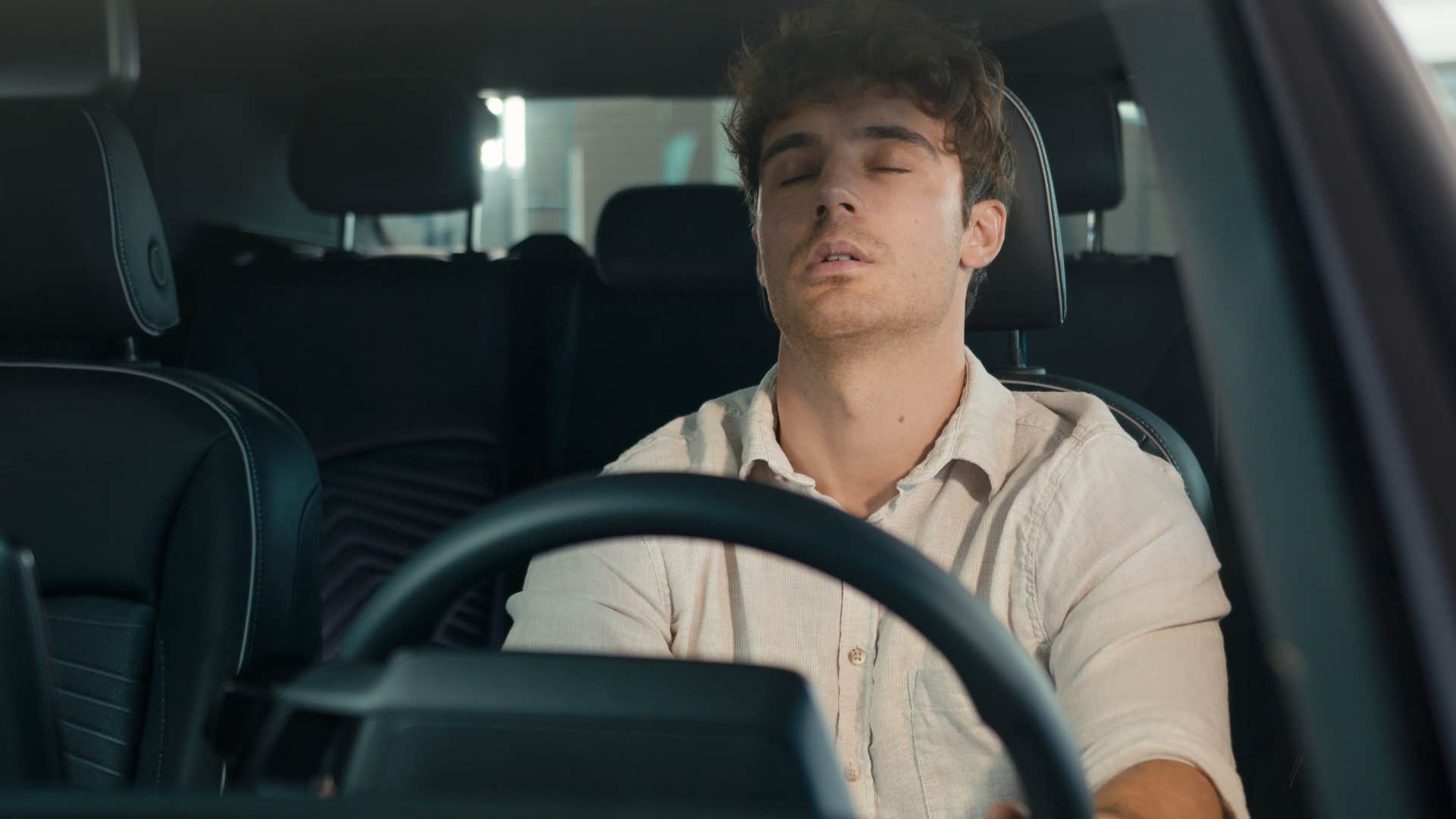 man who lacks self-discipline sitting in his car