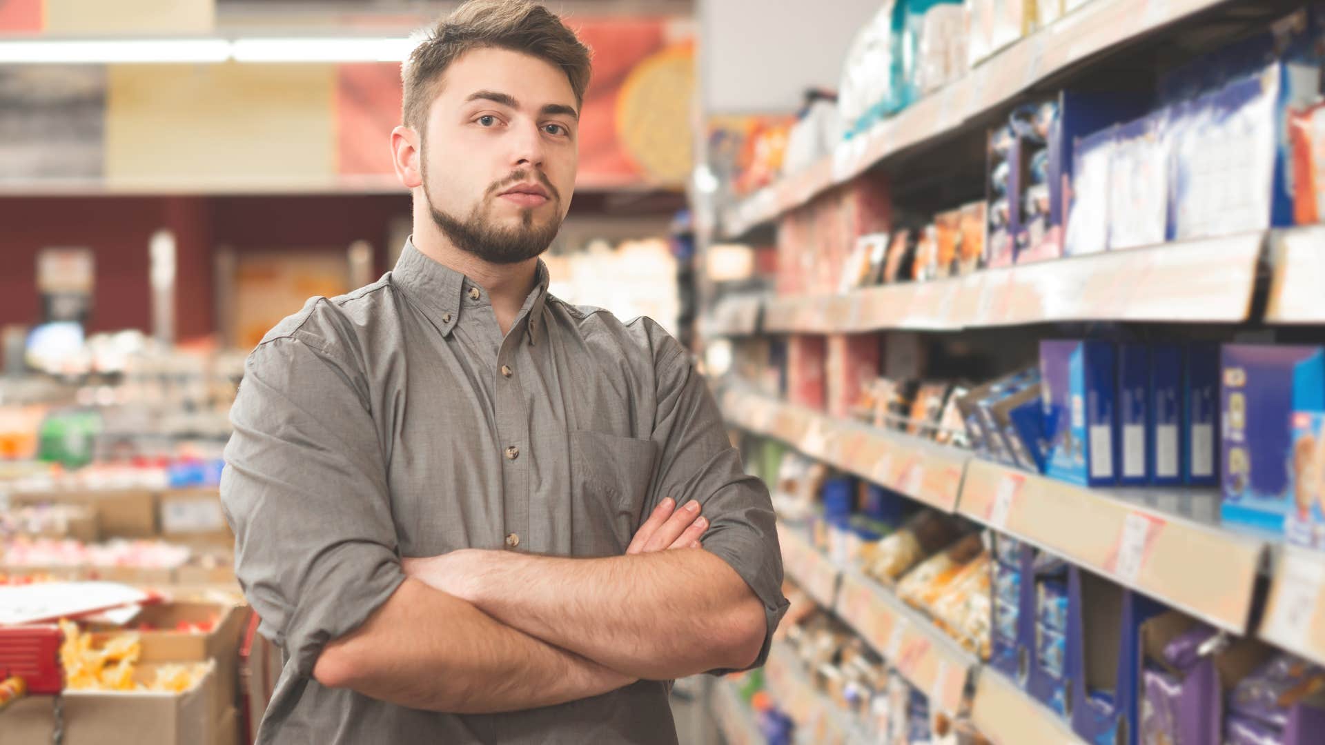 smug man who never takes accountability standing in a grocery store