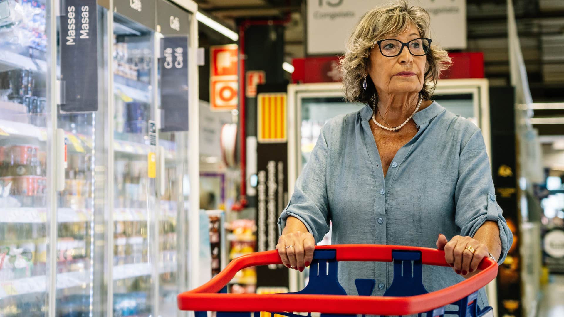transactional woman shopping seriously in a grocery store