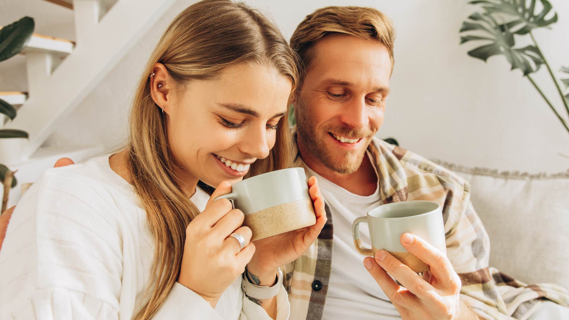 deeply creative people who prefer tea over coffee usually have these surprisingly grounded personality traits Deeply creative woman drinking tea with her partner.