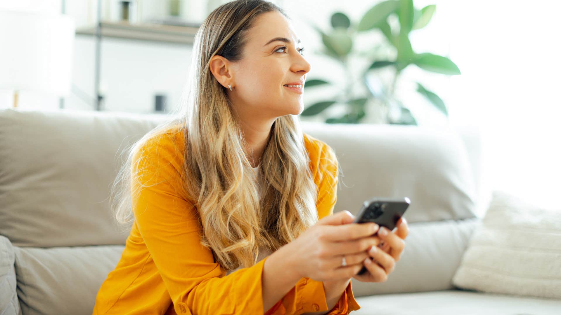 woman smiling while staying silent in a group chat