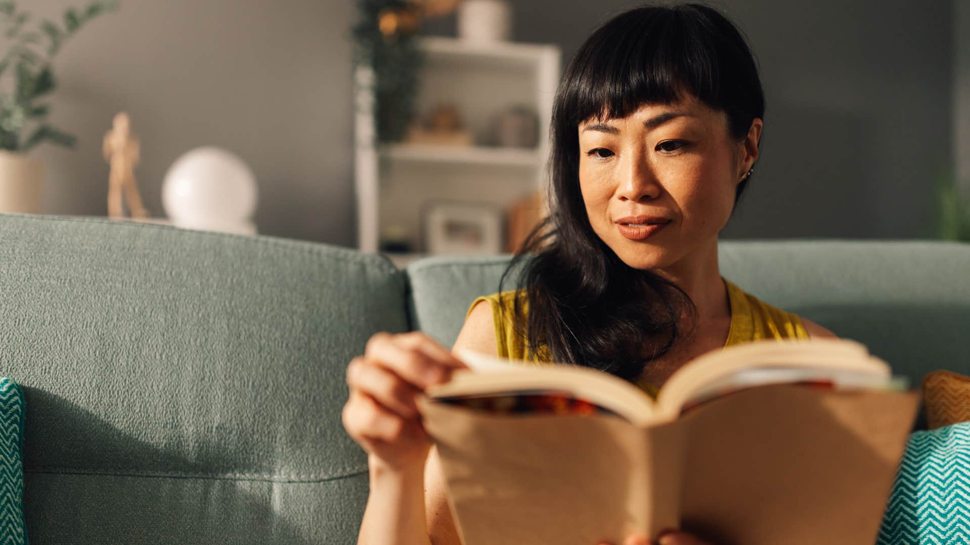 deeply emotional people who still read physical books instead of scrolling usually have these rare personality traits deeply emotional woman reading at home