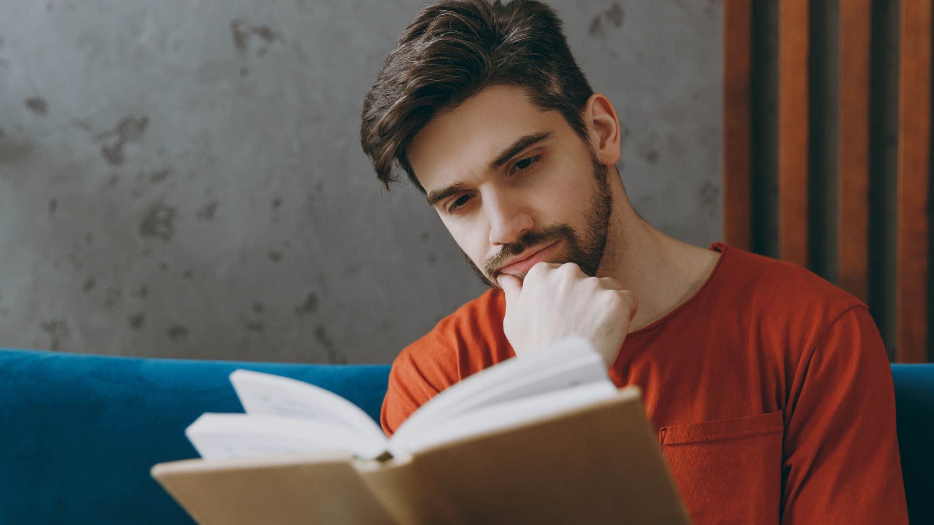 introspective people who still read physical books instead of scrolling usually have these rare personality traits introspective man reading a book