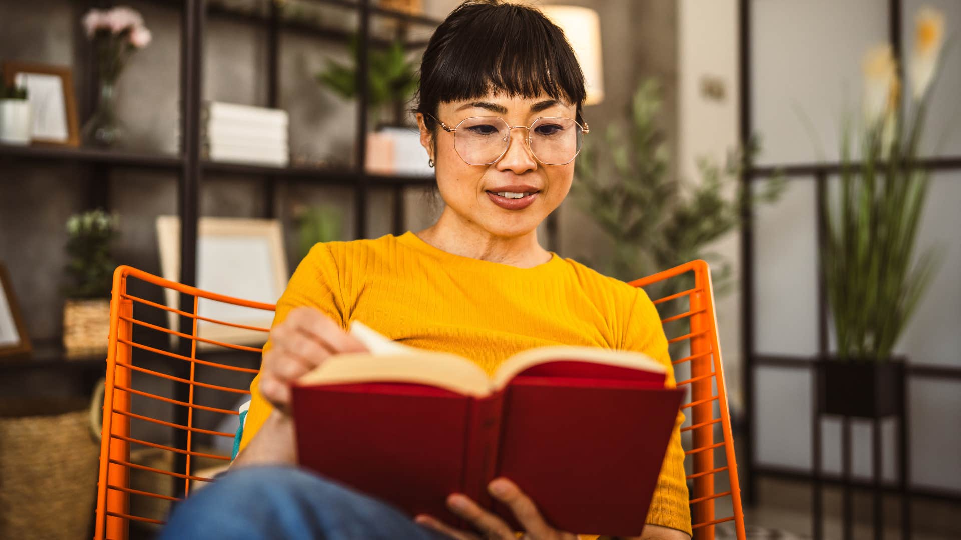 self-aware people who still read physical books instead of scrolling usually have these rare personality traits self-aware woman reading at home