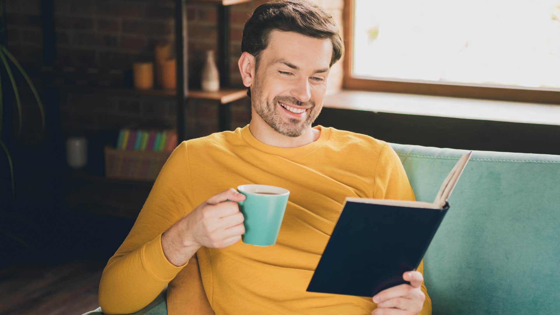 willing to give people grace people who still read physical books instead of scrolling usually have these rare personality traits man drinking coffee and reading at home