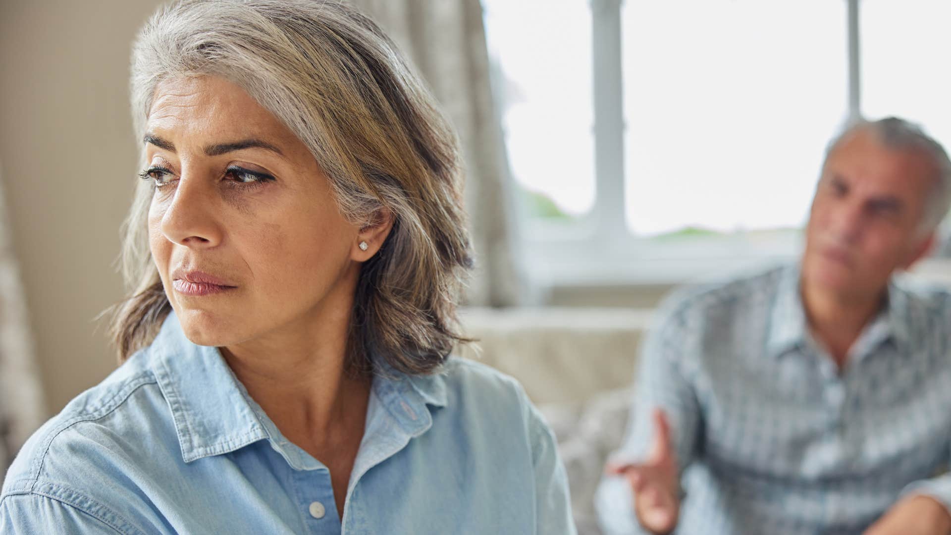 Man calling his upset wife "dramatic" at home.