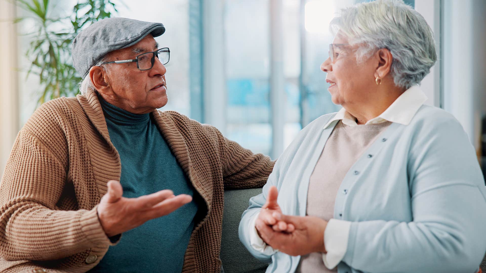 Intimidating man talking to his wife.