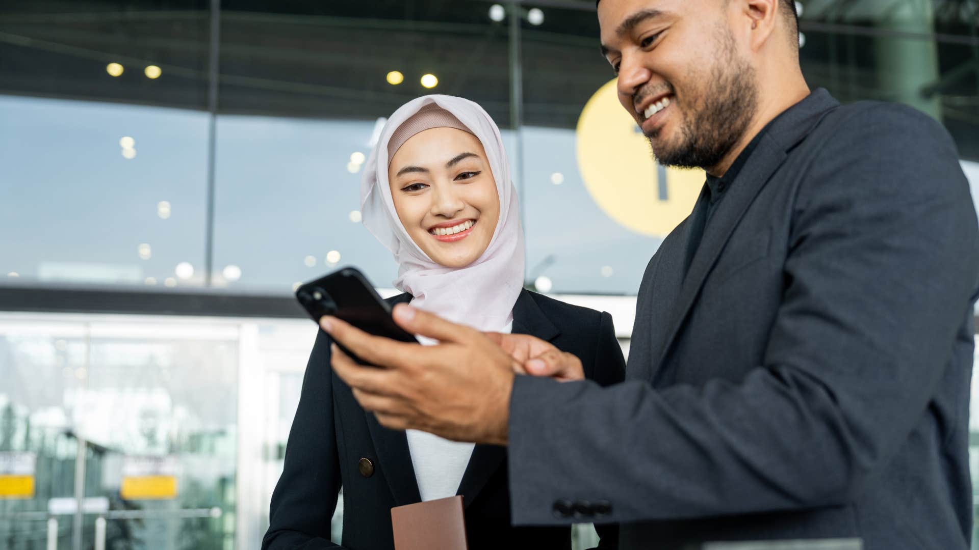 empathetic woman smiling with an airport worker