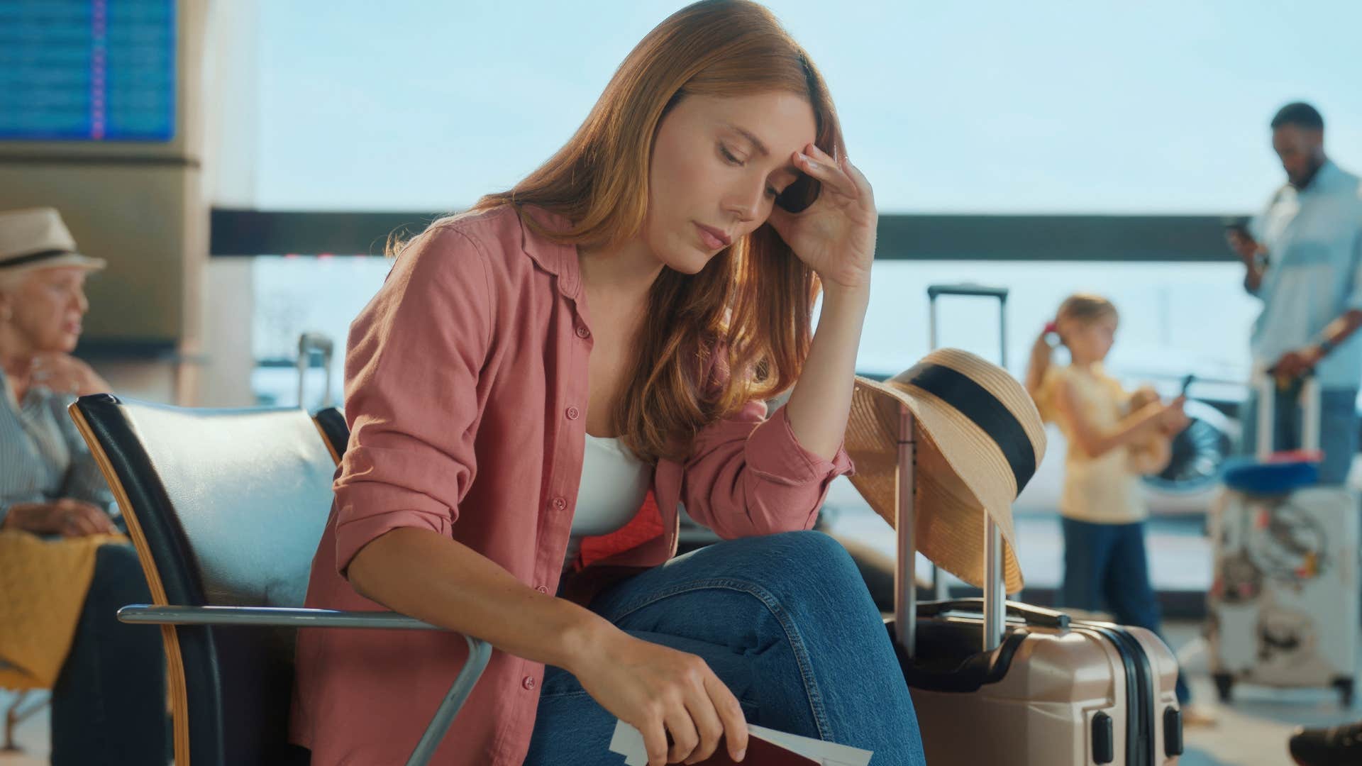 claustrophobic woman at the airport looking stressed