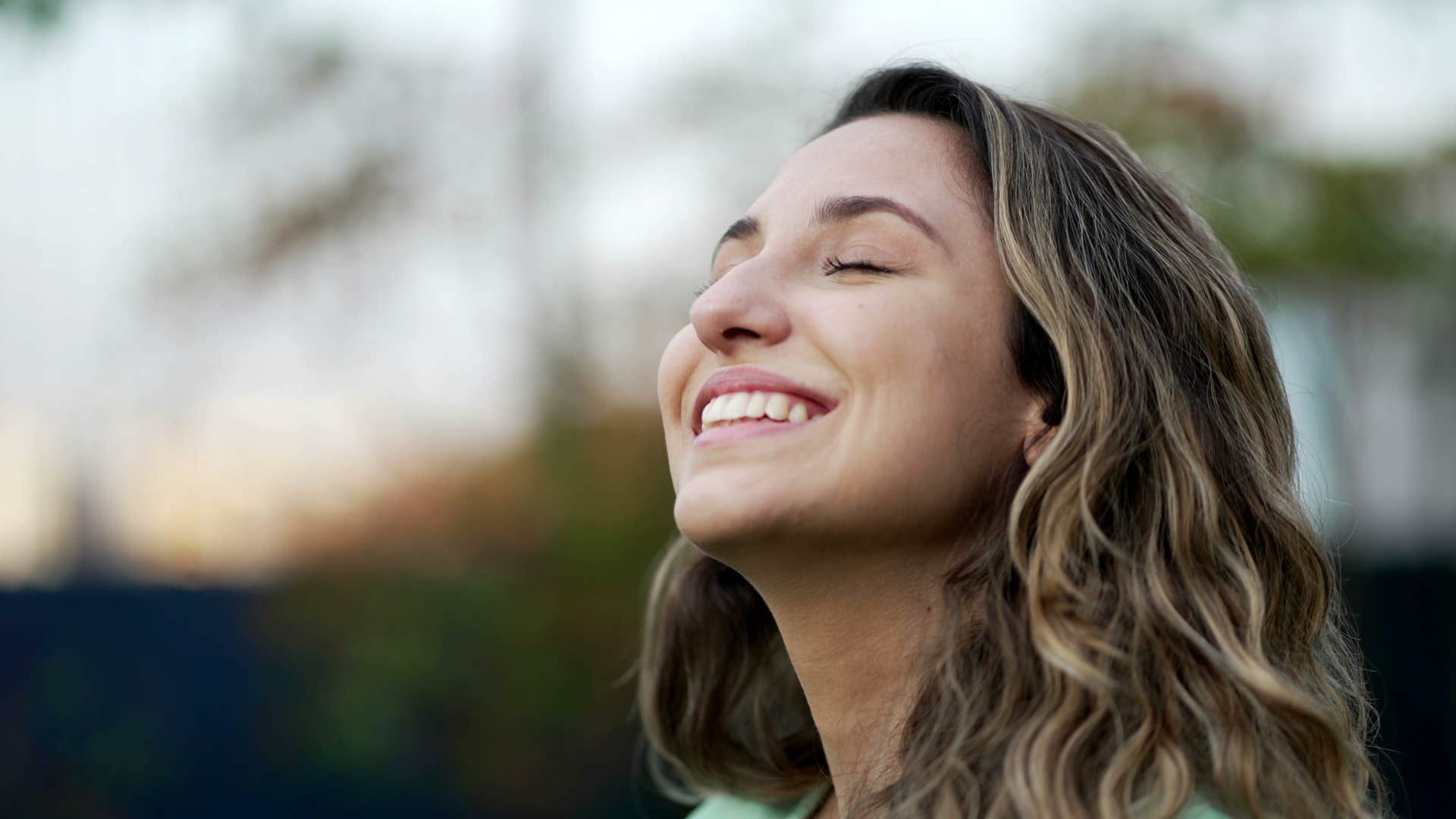 woman smiling and letting go