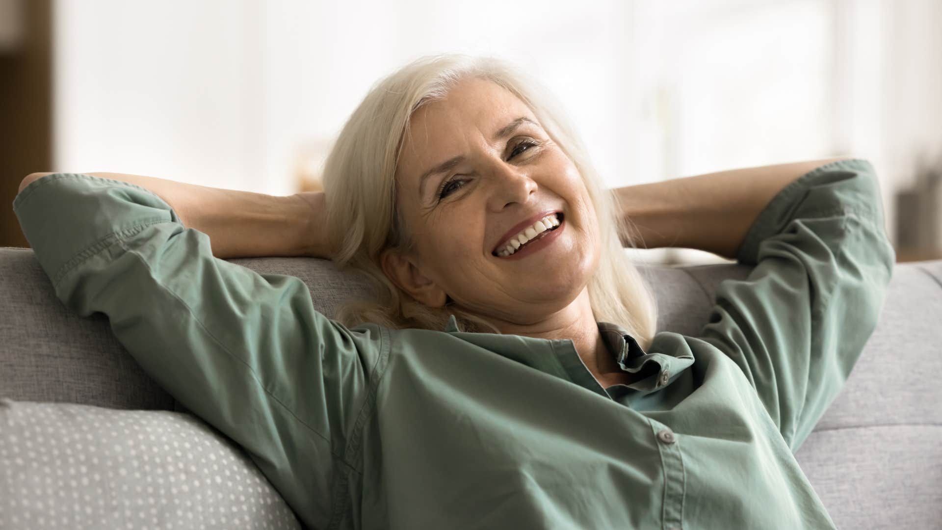 calm woman relaxing on her couch