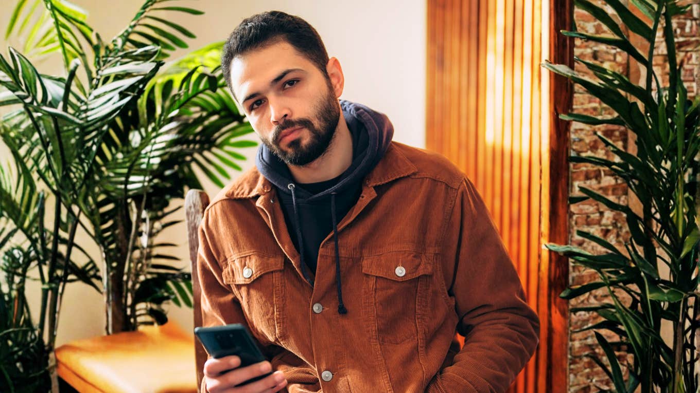 The Little Phone Games Men Play When They’re Not Really Serious About You Man who isn't serious abouyt you, playing phone games.