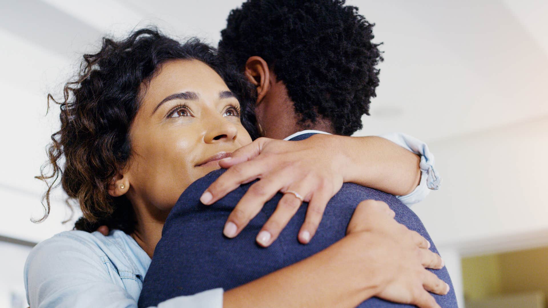 woman who is loyal hugging a man who is afraid to lose her
