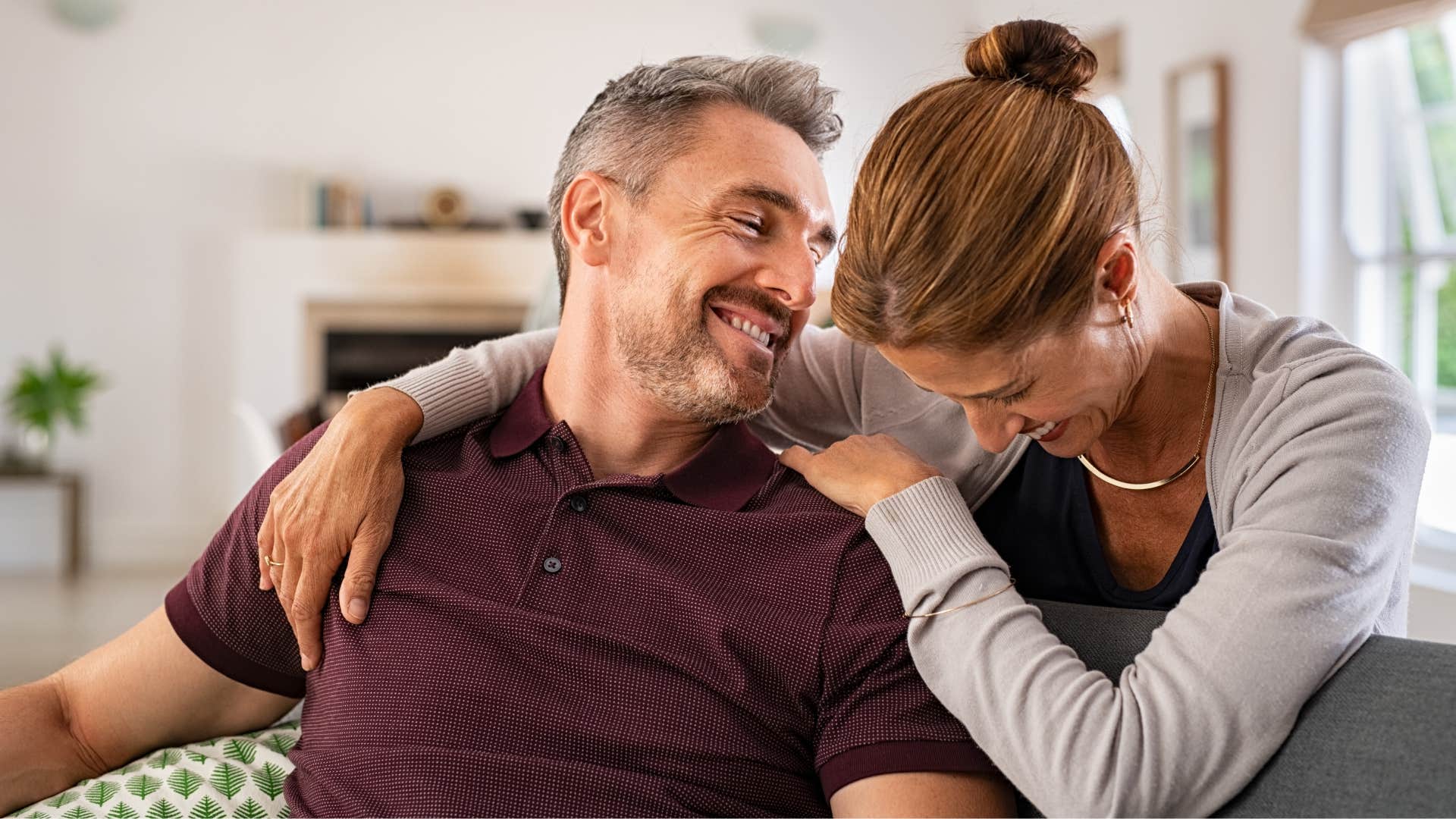 playful woman with a man who is afraid to lose her