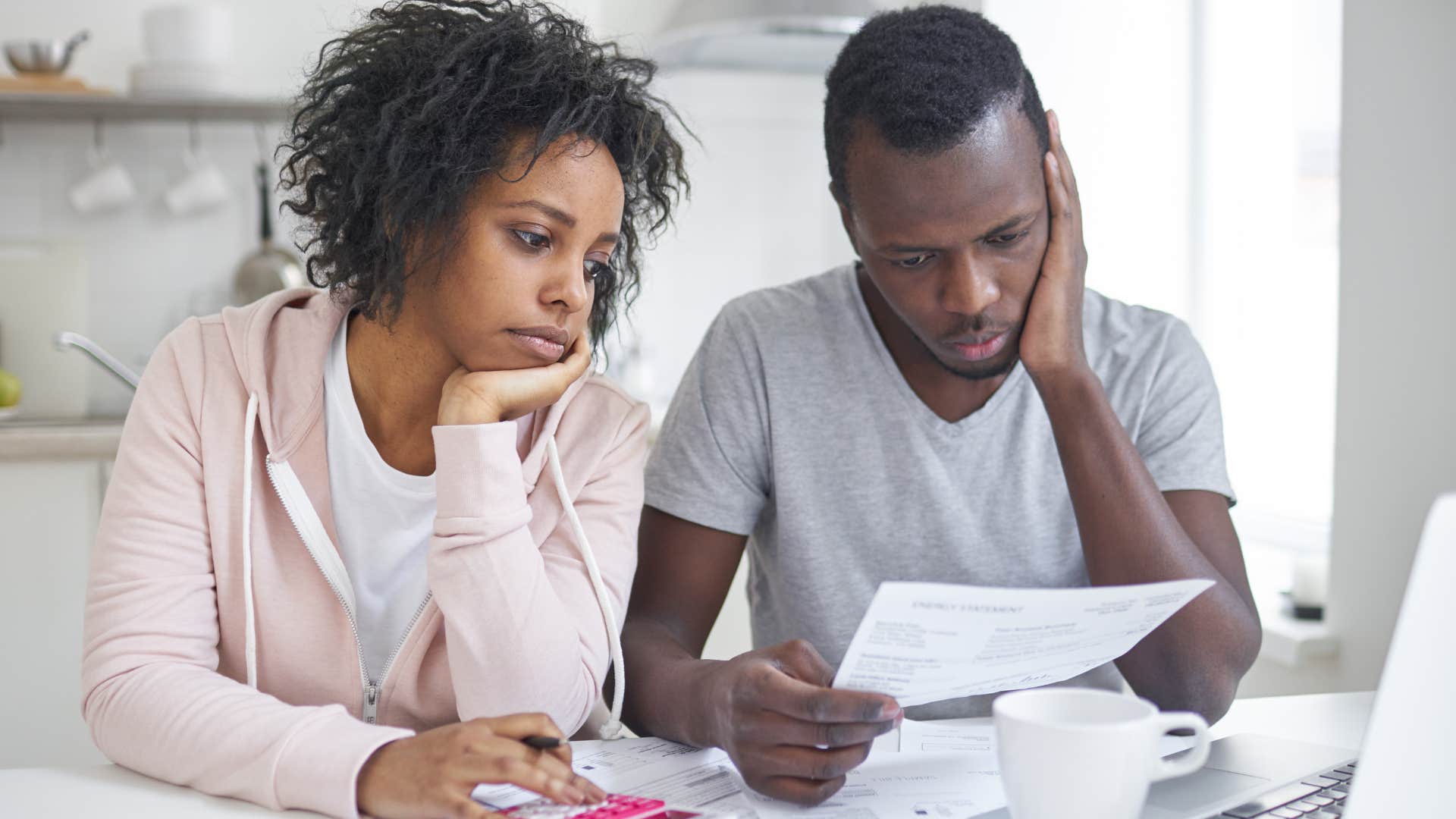 gen z couple who can't afford to have a family doing bills