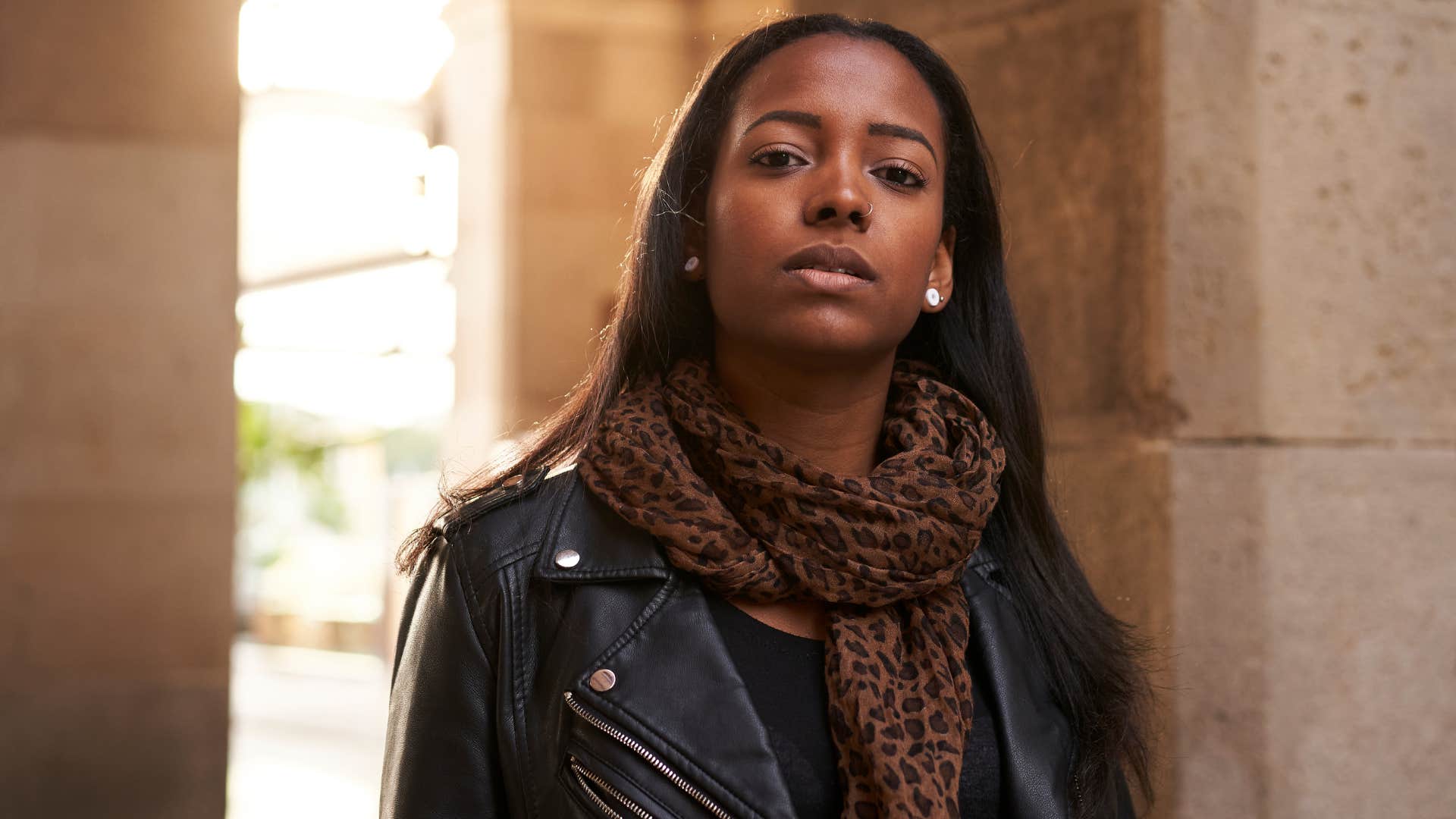 upset gen z woman who knows that hard work doesn't guarantee success