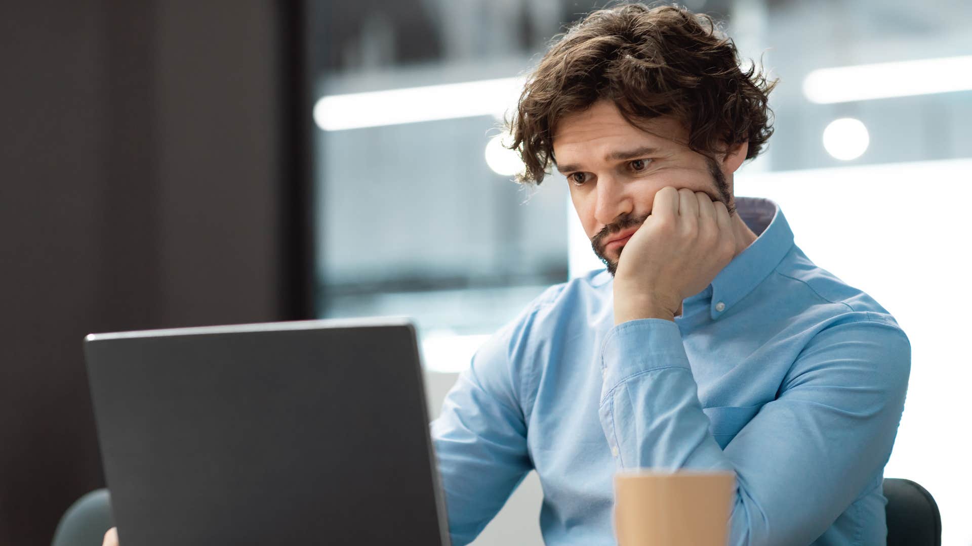 gen z man stressed out by trickle down promise that isn't realistic anymore