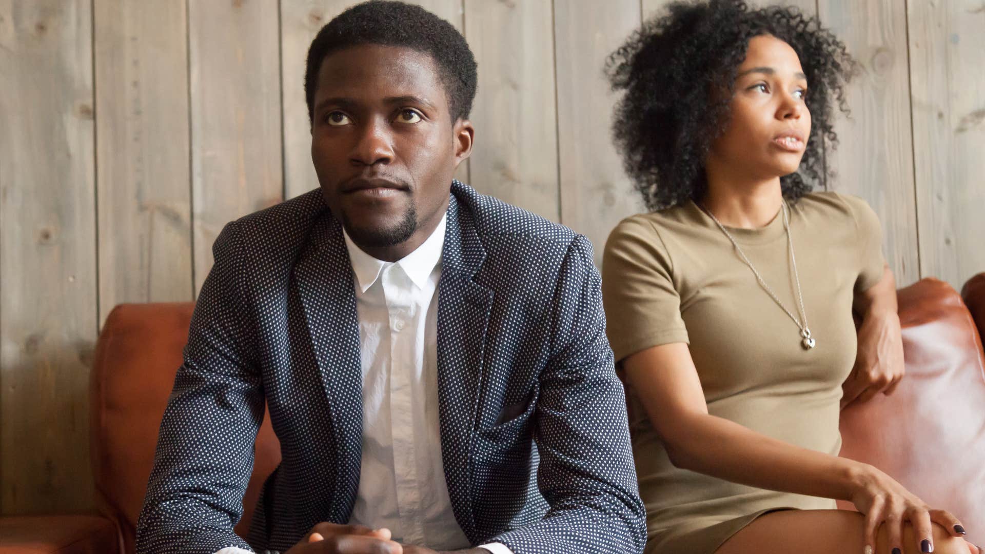 man in a toxic relationships sitting with his partner