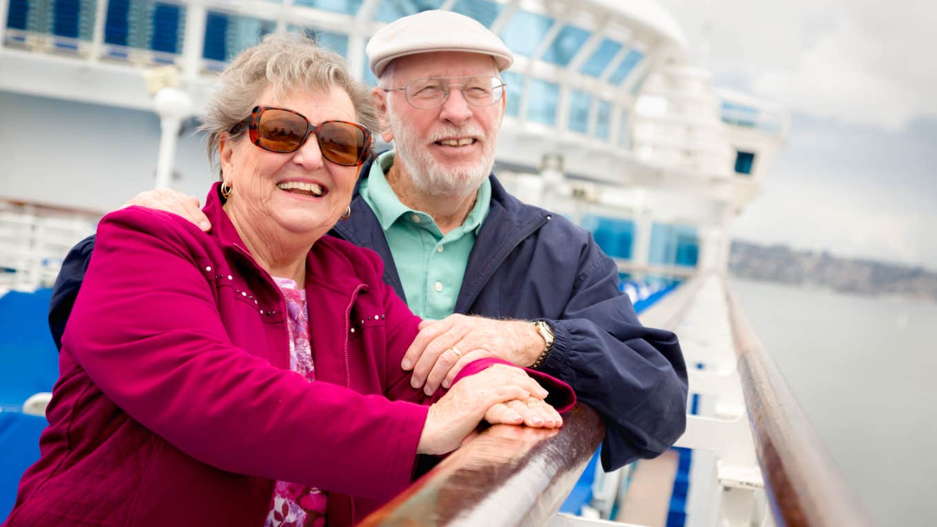 older couple smiling together on cruise ship