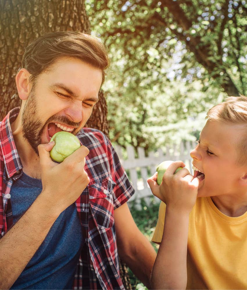 Science-Backed Ways Good Dads Change Kids Lives Playing A good dad plays with his son while eating an apple