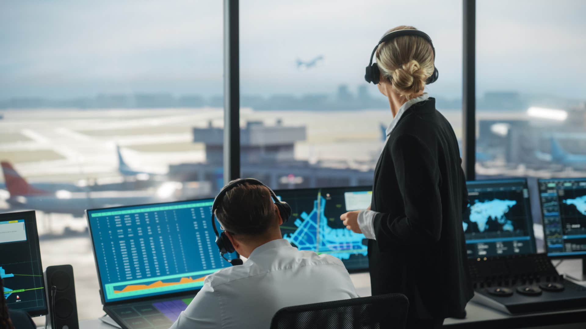 air traffic controllers in airport tower