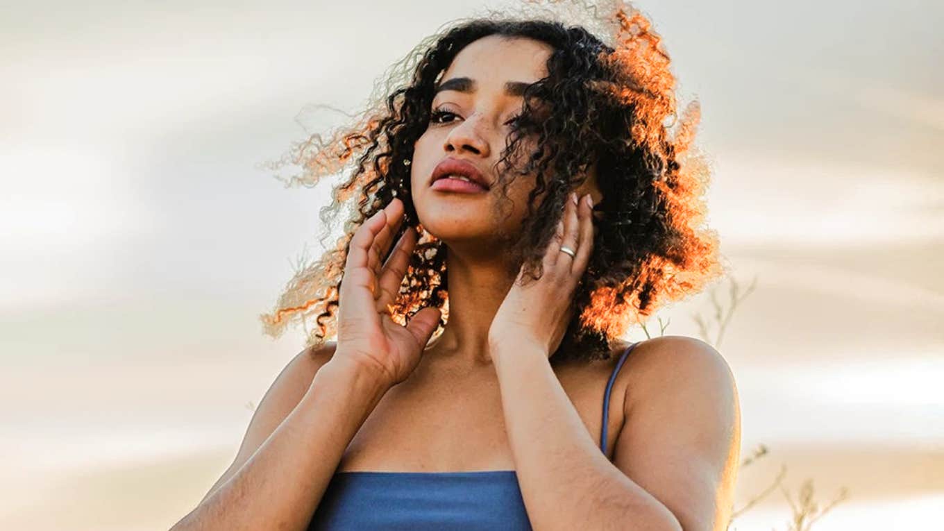 TK Signs You’ve Been The Strong One For Too Long — And Have Lost Touch With Your Feminine Energy  Woman who has been strong for too long and has lost touch with feminine energy.