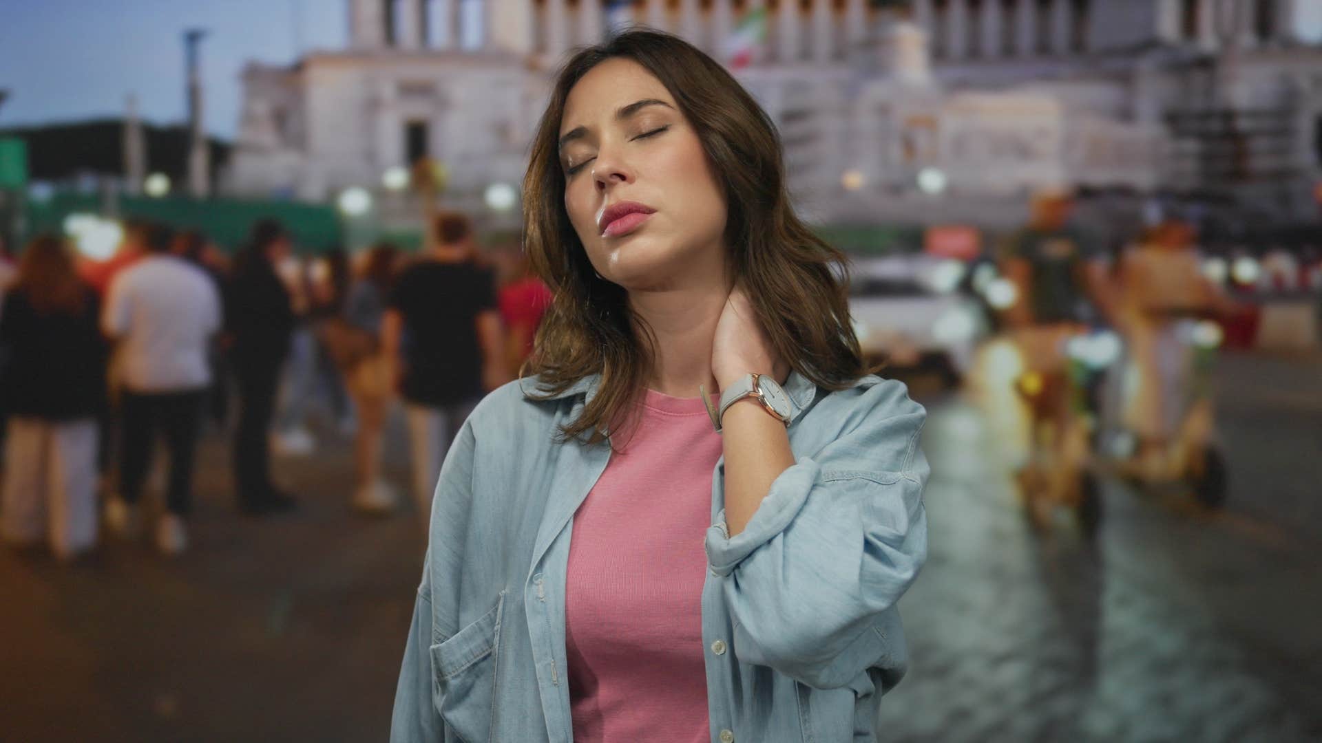 woman in jean jacket feels tense as crowded places drain her