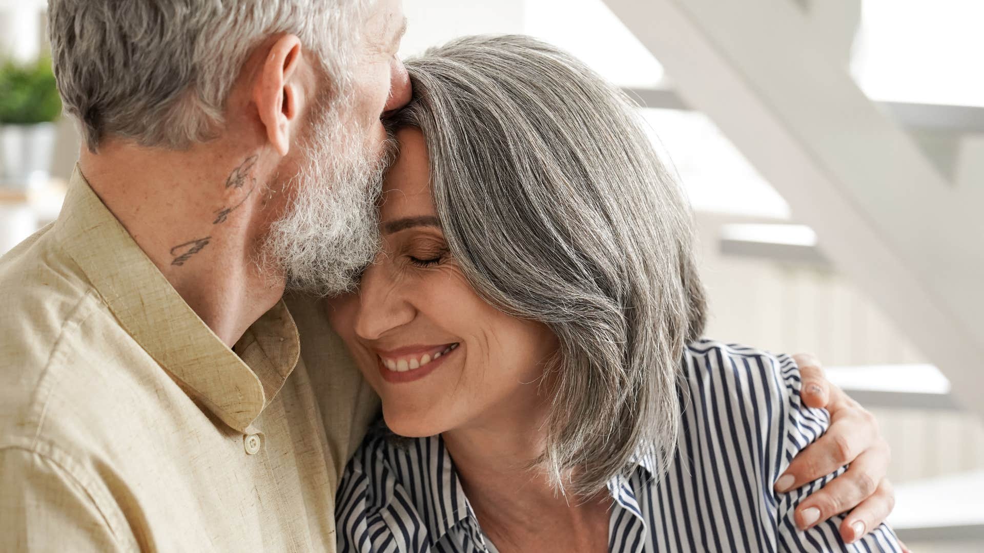 Woman who always feels emotionally supported hugging her partner.