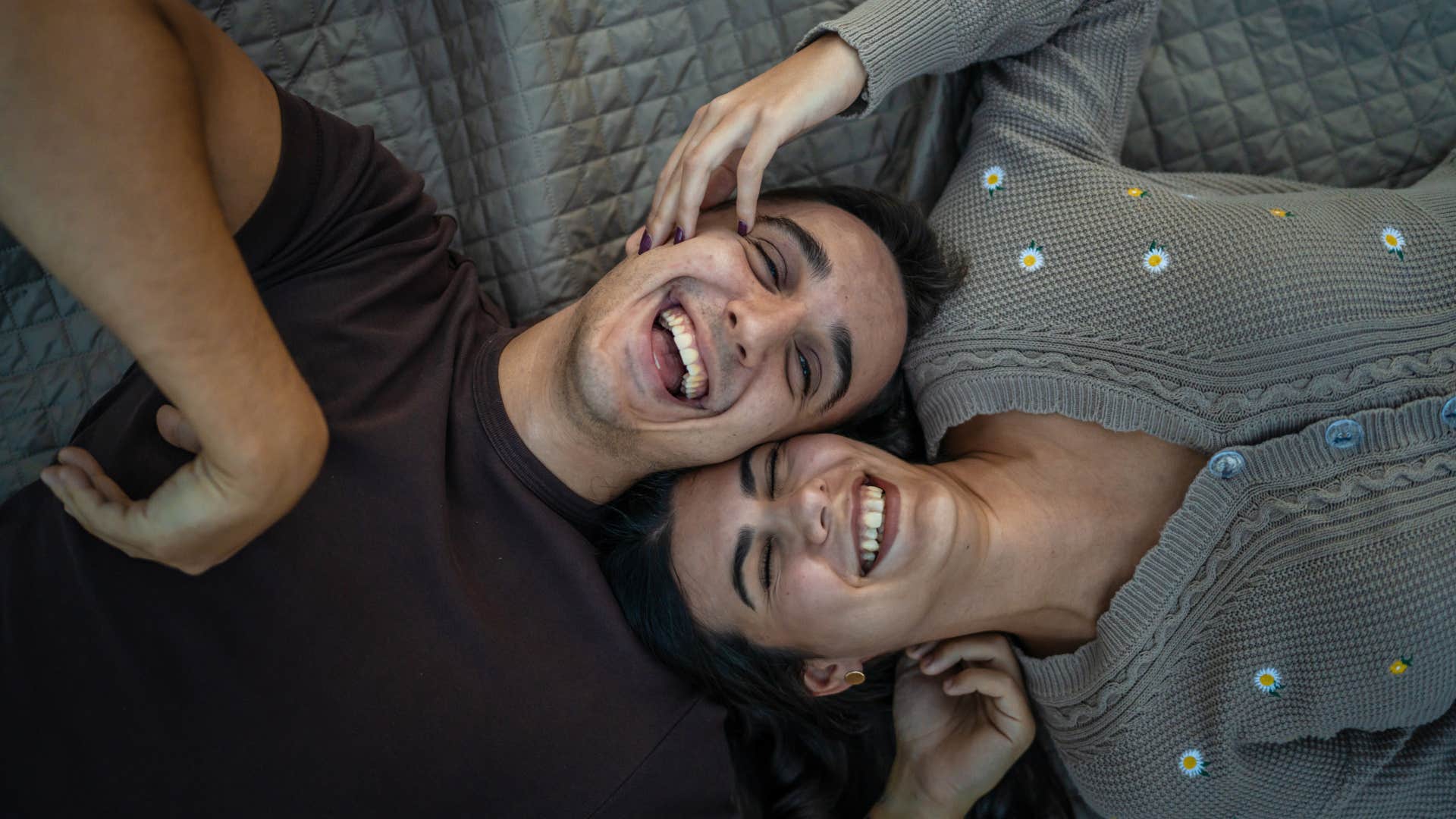 couple with an undeniable magnetic attraction can't stop smiling at each other