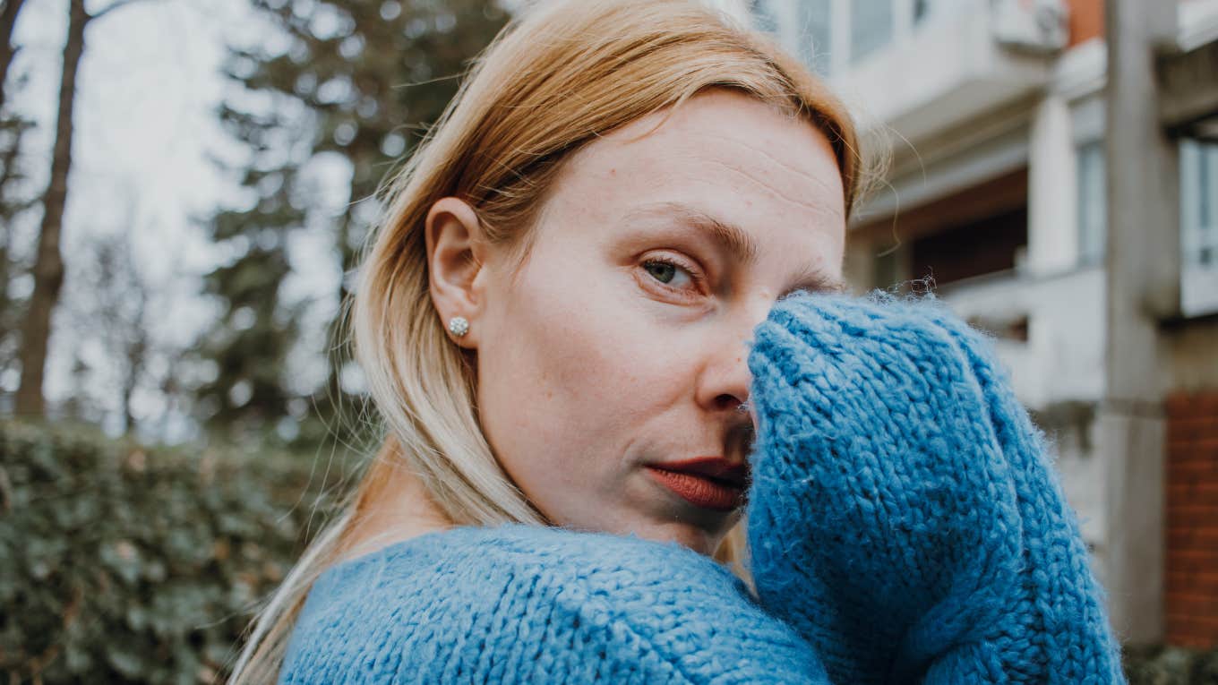 empathic woman absorbing emotions of others looking sad