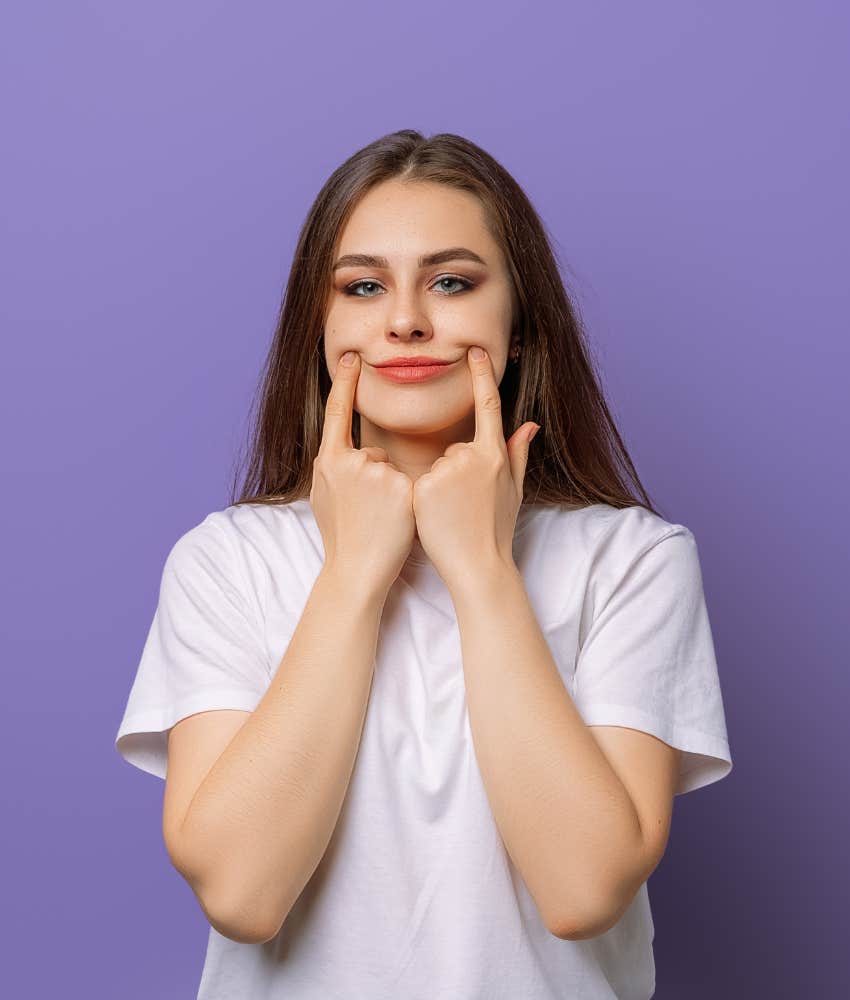 Signs you've been strong one too long and lost touch with feminine energy happy Strong person fakes a smile