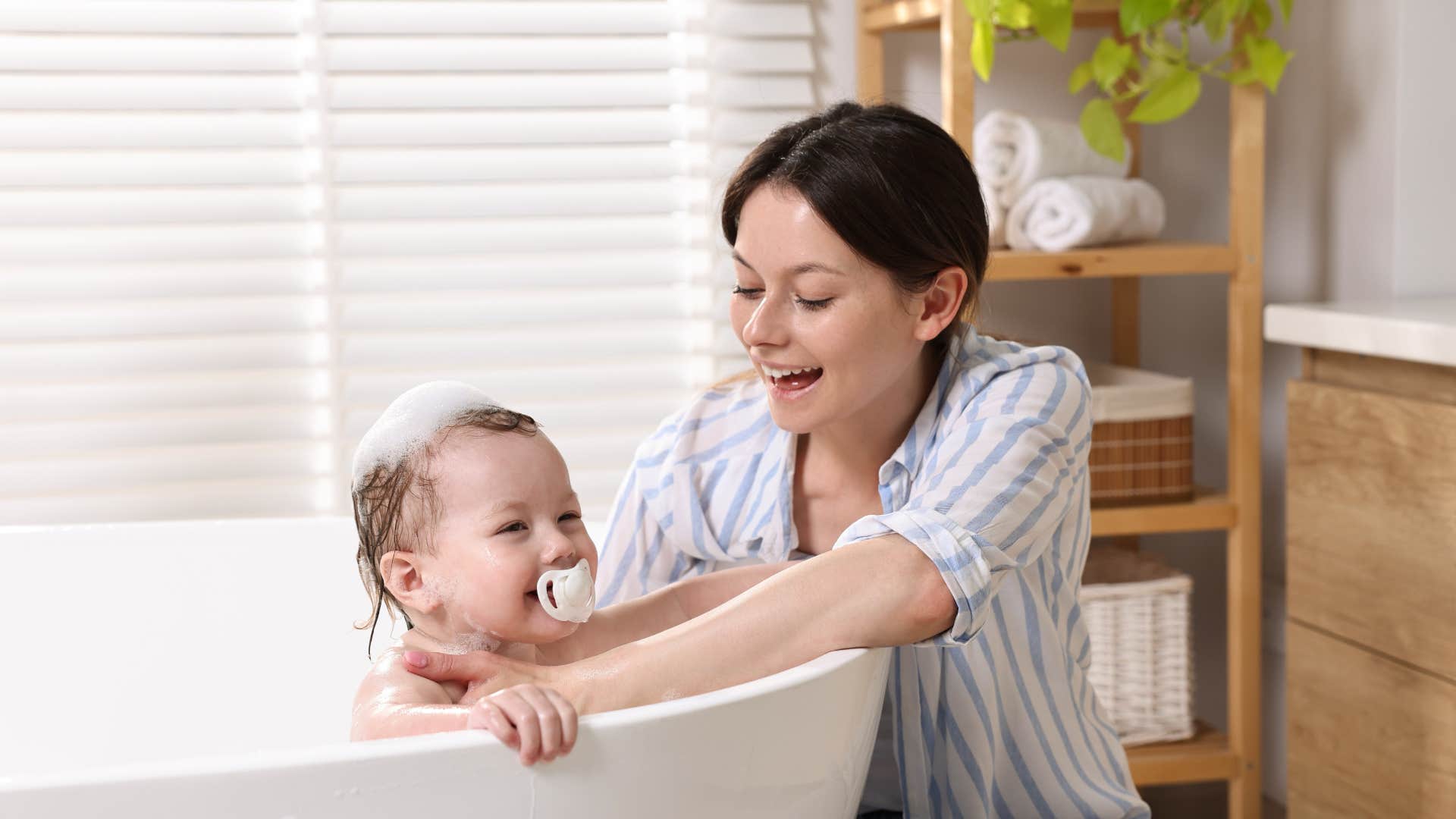 woman who bathes kids every day as she realizes it doesn't make her a good mom