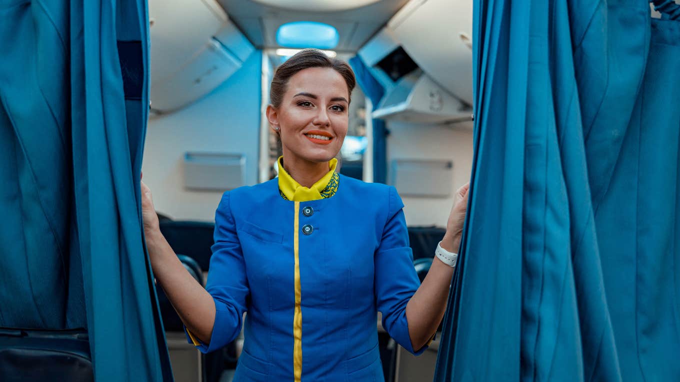 The Simple Behavior That Lets Flight Attendants Know They Can Trust You flight attendant on a plane
