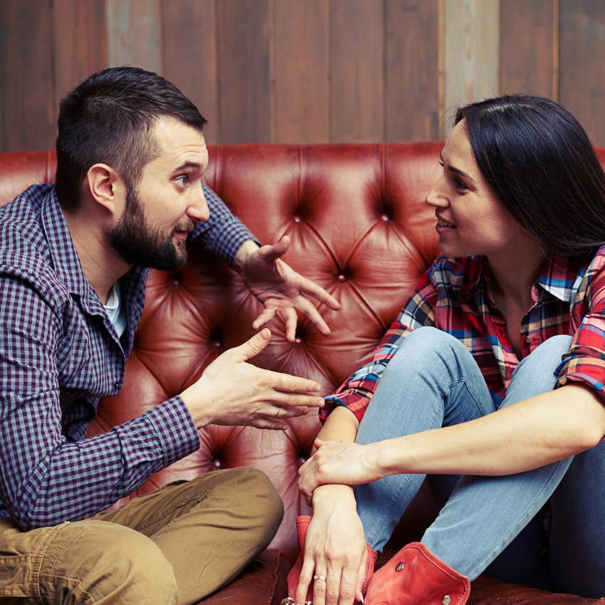 couple who are arguing like adults as they share the floor