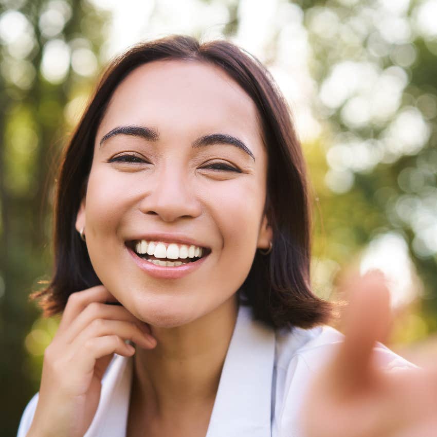 simple habits of naturally upbeat people refill their containers woman who is naturally upbeat as she refills her container