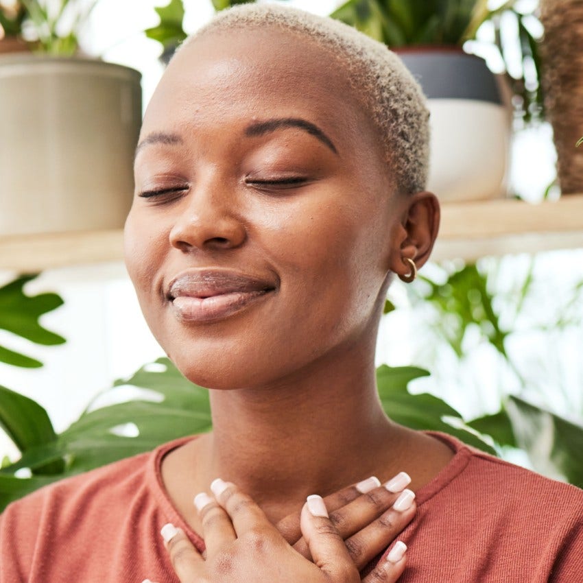 woman who is manifesting her wildest dreams as she breathes