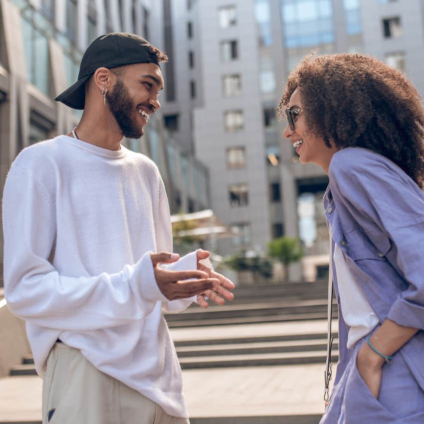 woman who is trying to understand what man is thinking by where his feet is pointing