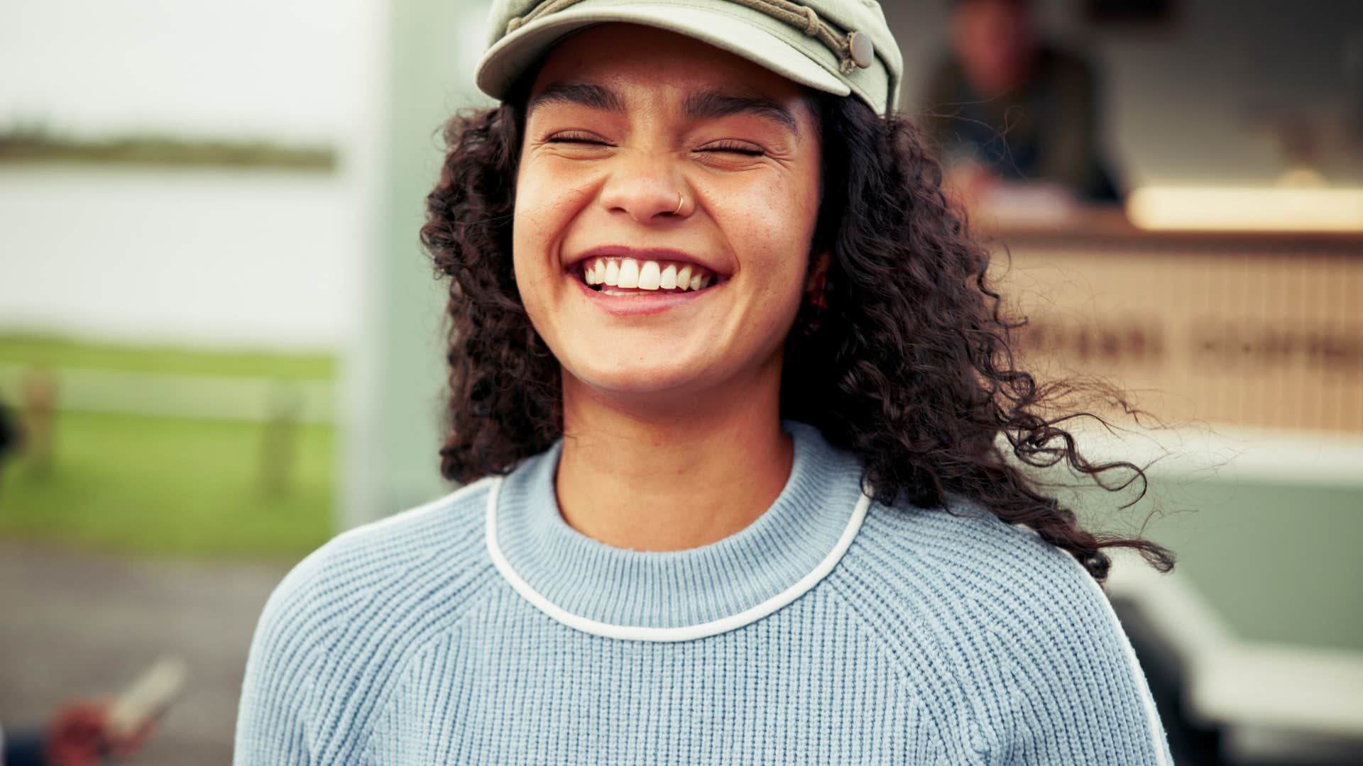 woman who builds emotional resilience as she laughs